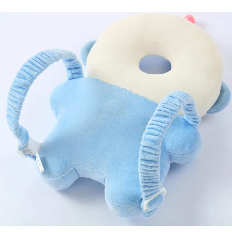Front view of a soft baby head protector backpack in blue white astronaut design featuring a breathable plush donut head cushion and shock absorbing back pad with elastic adjustable shoulder straps, shown ready to wear on toddler, lightweight hypoallergenic feel helps prevent bumps during crawling and first steps ideal gift for new parents